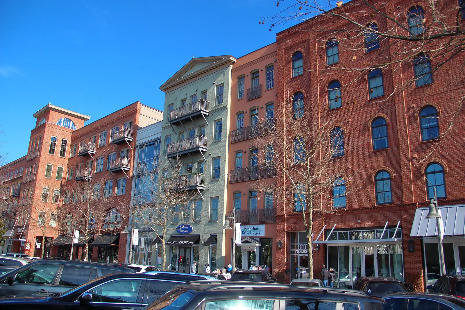 Main Street in downtown Woodstock, lined with shops and restaurants.
